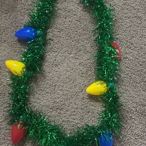 Amazon Green Tinsel Necklace with Red, Yellow & Blue Bulb Charms